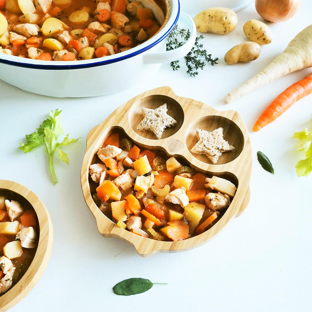 A serving of Baby Chicken Casserole next to a casserole dish of Baby Chicken Casserole