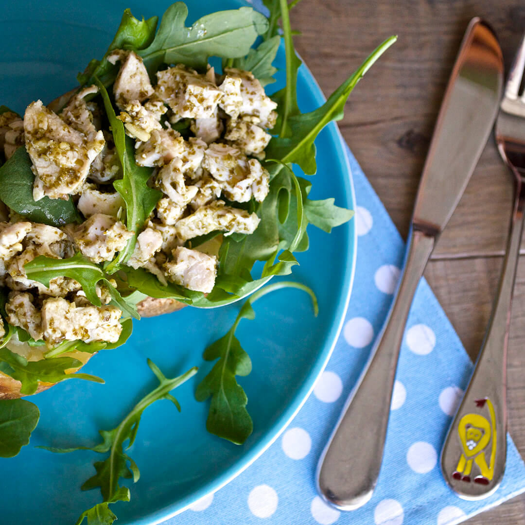 Jacket Potato With Pesto & Chicken served with a mixed leaf salad