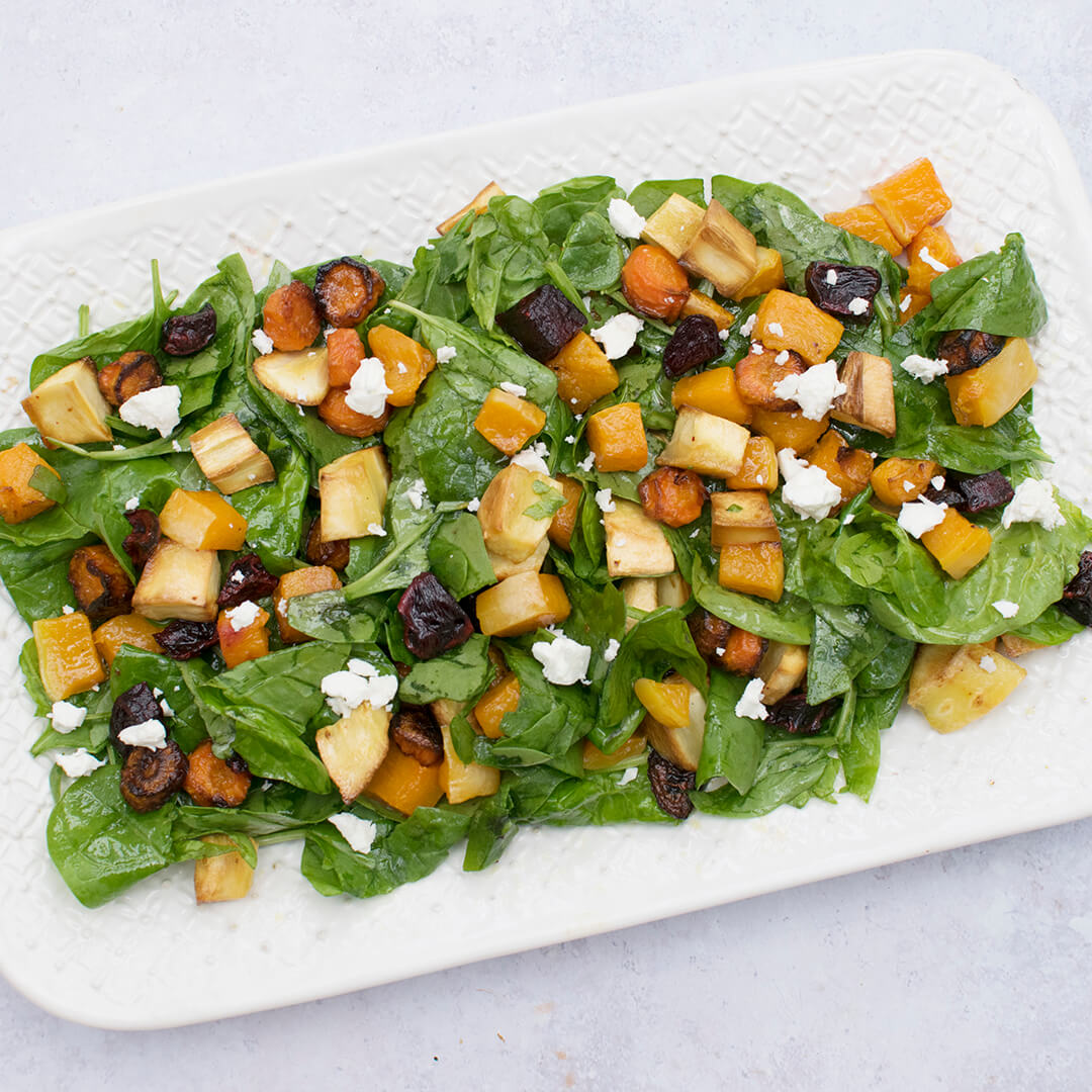 Roasted Vegetable Spinach Salad on a serving dish