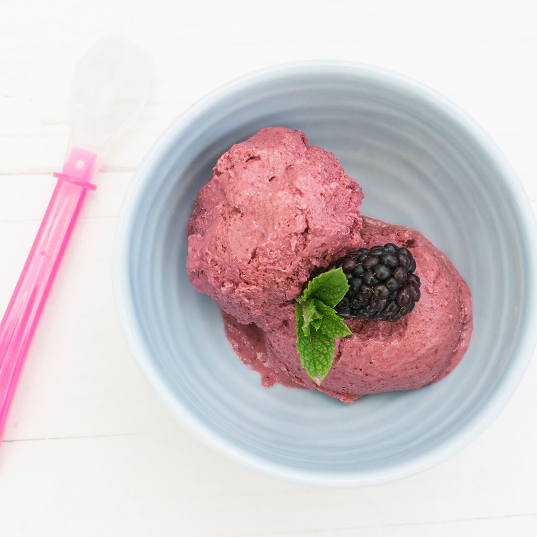 Banana & Blackberry Yogurt Ice Cream served with a fresh blackberry and mint leaves