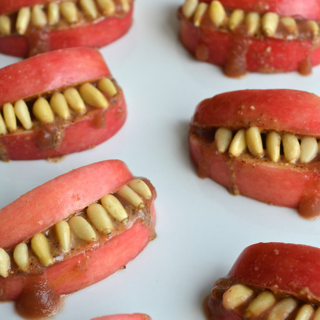 Scary Apple Teeth made with apple slices to create the lips/mouth and pine nuts/sunflower seeds to make teeth