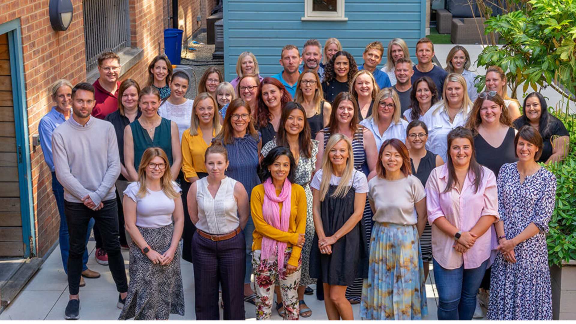 Organix employees at Organix HQ in the garden