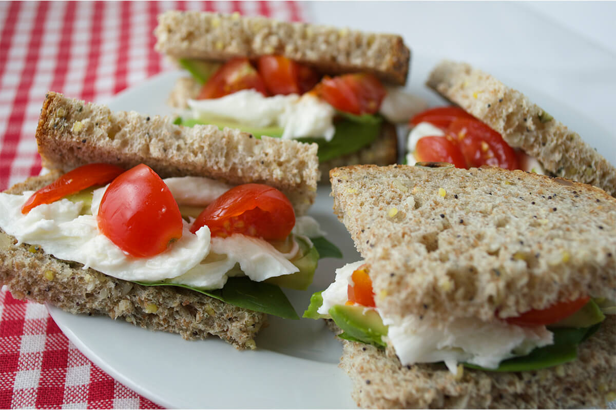 Tomato, Avocado & Mozzarella Sandwich cut into suqares