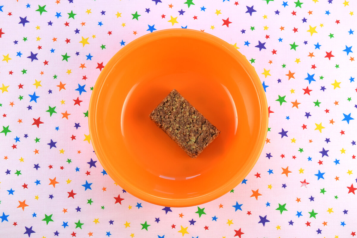 Oaty bar in the middle of small bowl or plate