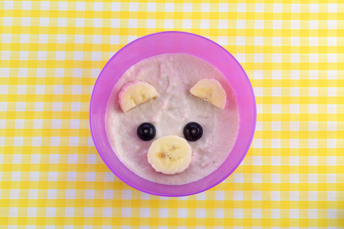 Two blueberry halves placed above banana circle to make eyes