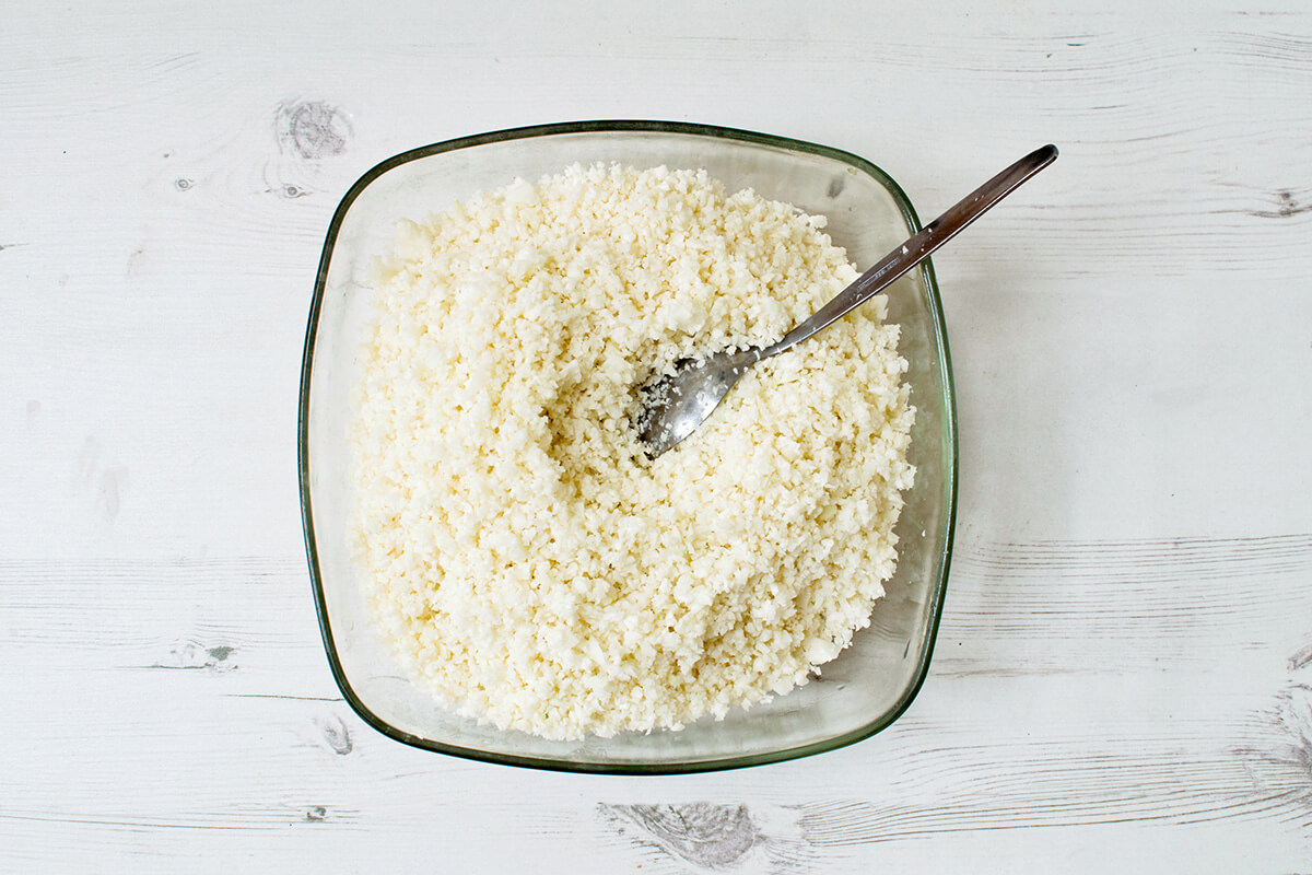 A bowl of blended/grated cauliflower florets 