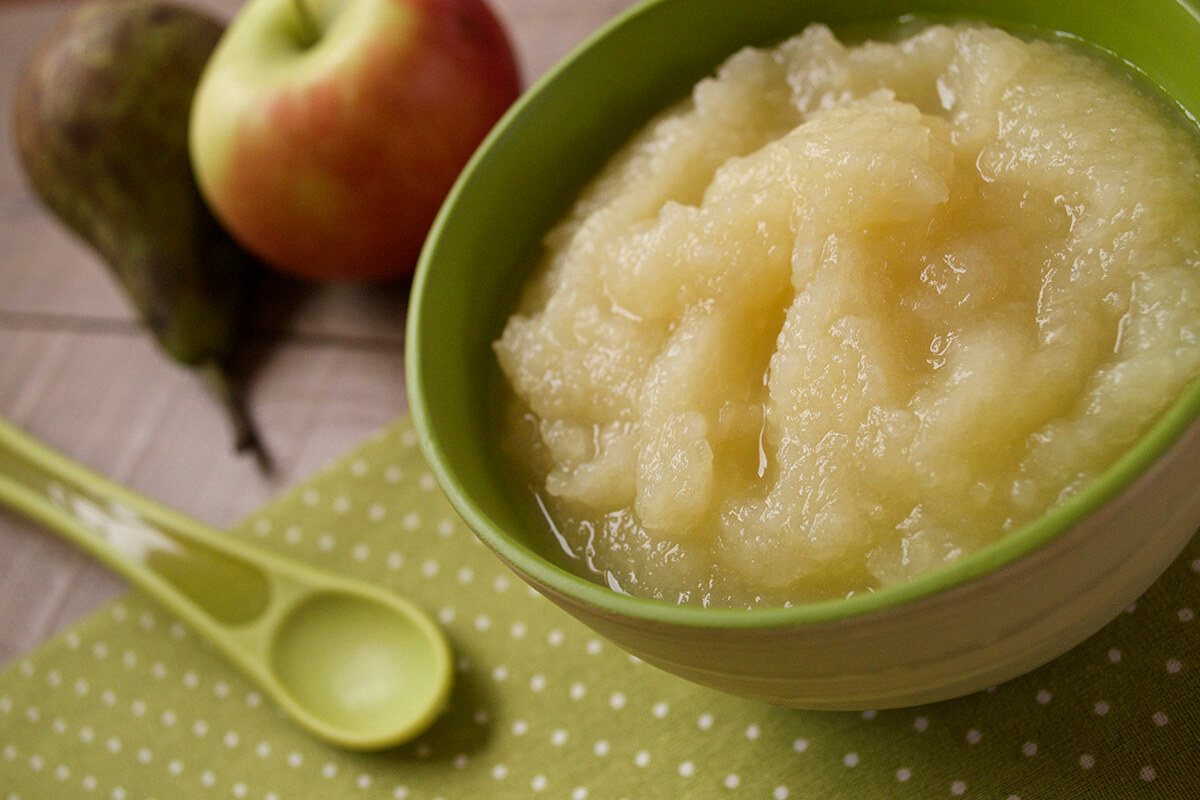 Simple Apple & Pear Puree in a bowl with a whole apple and pear next to it