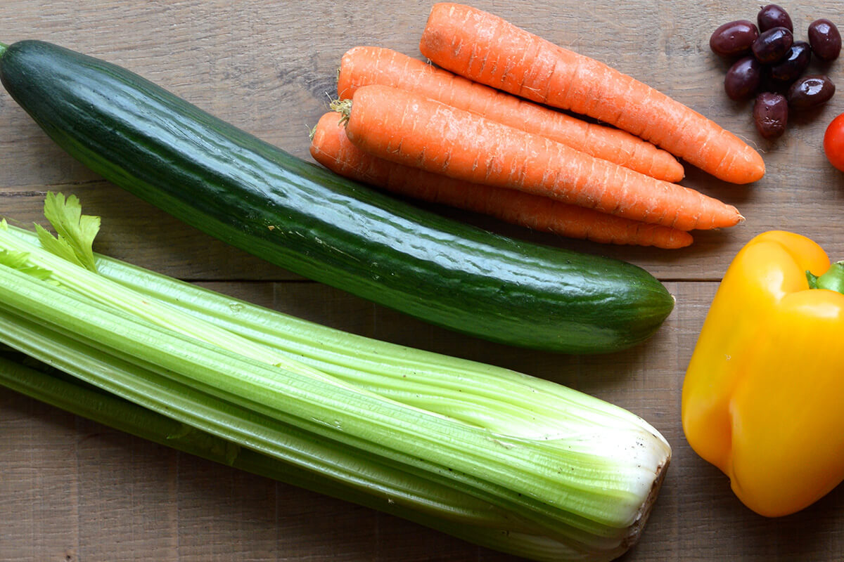 Celery, cucumber, carrot, olives and pepper on a table