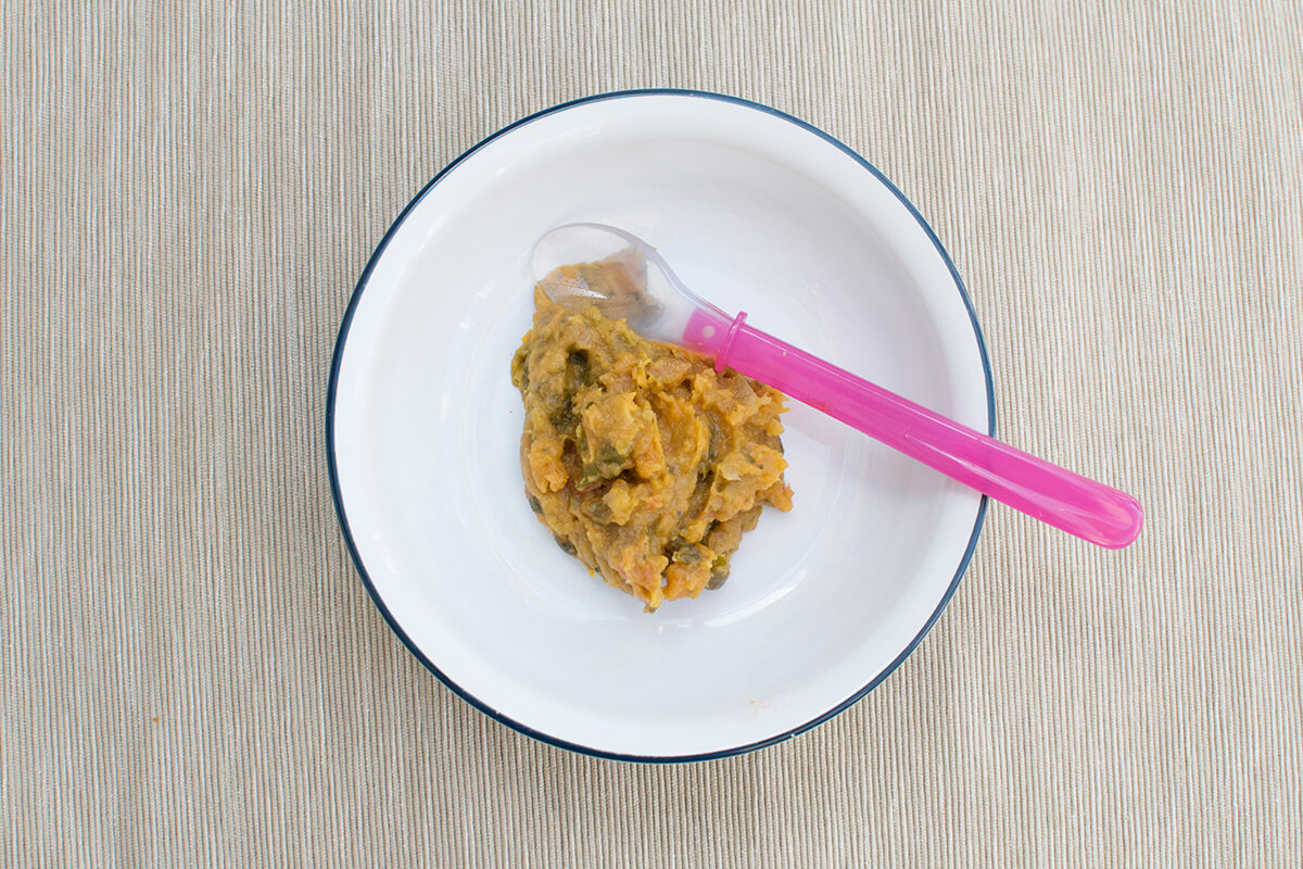 A small bowl of Sweet Potato, Chickpea & Spinach Baby Curry